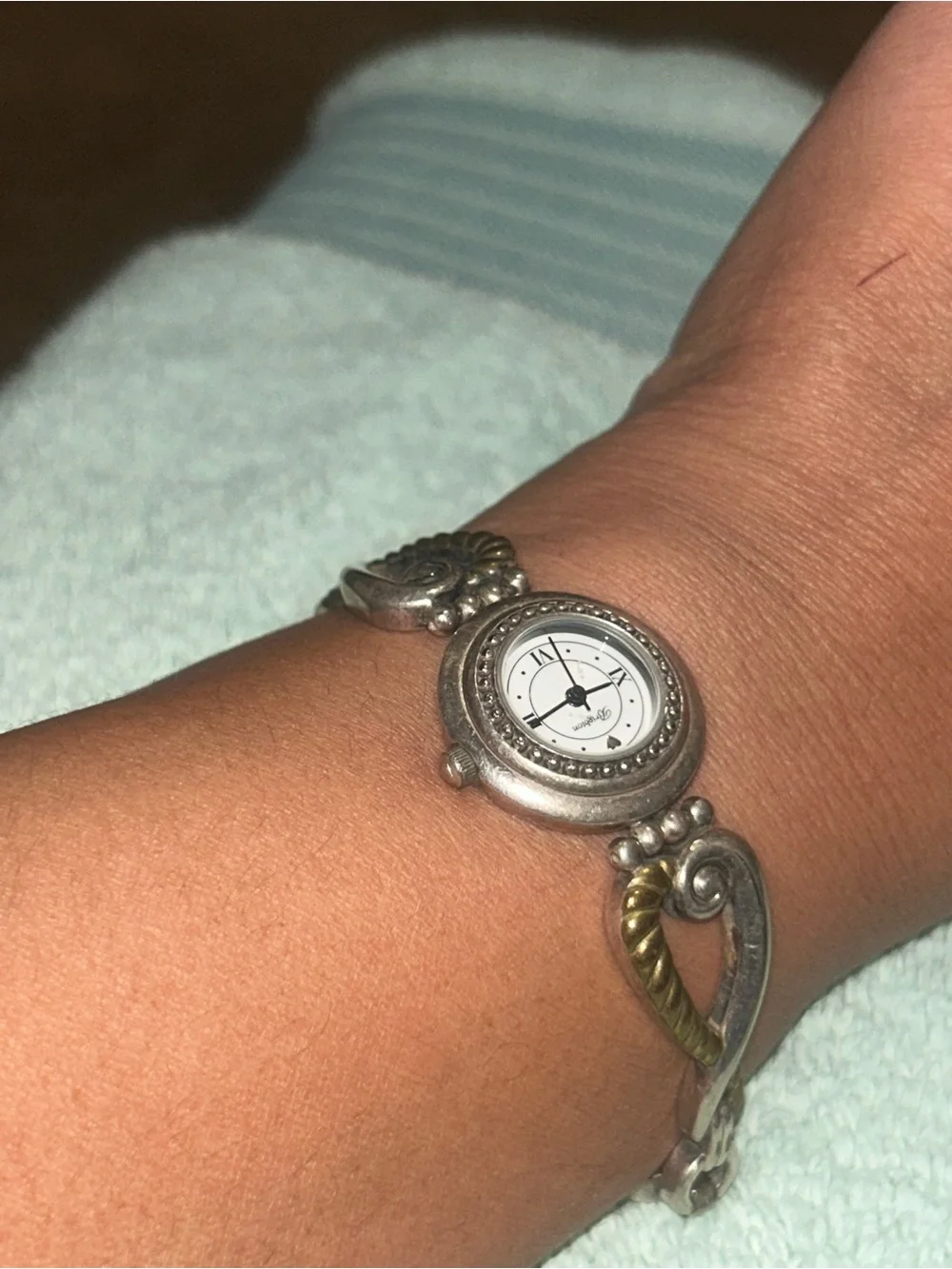 two-tone Brighton Charleston Watch featuring a round white face. RETIRED